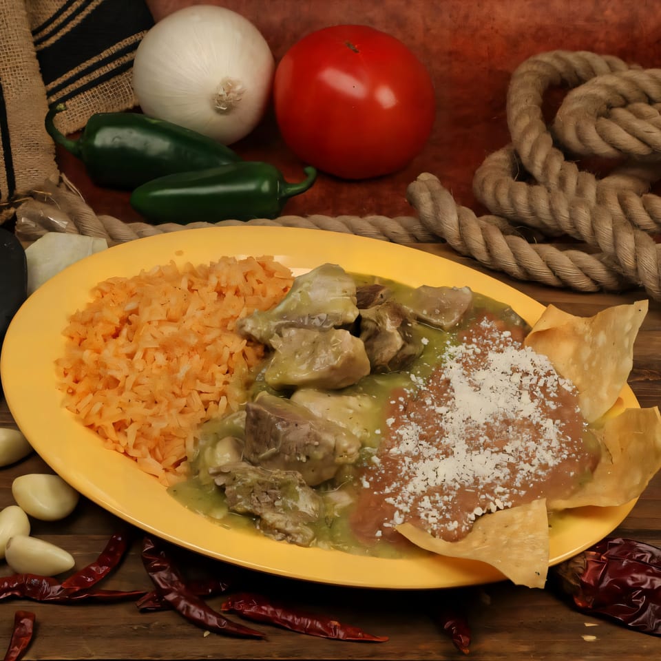Chilitos Mexican Grill's pork chile verde with rice, refried beans, and tortilla chips on a yellow plate.